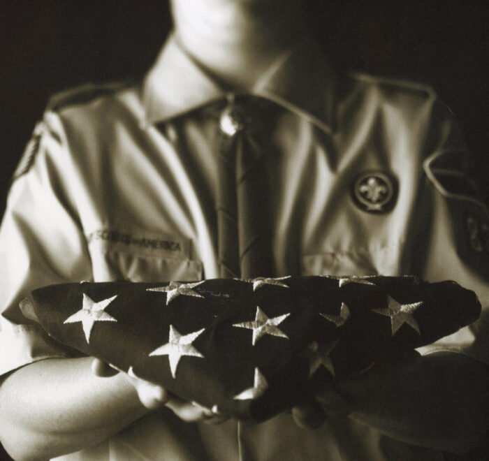 Boy Scout Holding American Flag